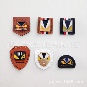 新款卡通饰品 可手缝小怪兽五金织带高频压皮标