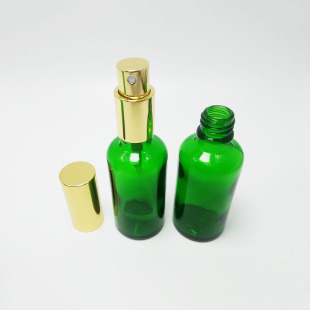 厂家供应50ml绿色精油瓶 香水玻璃瓶配 压泵金色喷雾盖