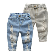 Quần áo trẻ em 2019 quần mới trẻ em quần jeans lỗ bé trai quần jeans mùa xuân và cotton mùa thu Quần jean