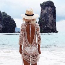 Châu Âu và Hoa Kỳ bãi biển ren backless bikini áo cánh kỳ nghỉ gợi cảm ăn mặc rỗng móc hoa chống nắng quần áo nữ Áo voan ren