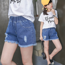 Quần áo trẻ em mùa hè 2019 cho bé gái quần nóng trẻ em mặc mới to trẻ em phiên bản Hàn Quốc của quần short denim lỗ một thế hệ Quần âu
