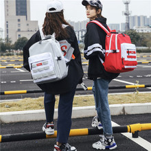 Túi xách nam nữ trung học giản dị ba lô dung tích lớn cá tính thời trang đường phố phiên bản Hàn Quốc của port gió ba lô nữ Túi học sinh trung học cơ sở