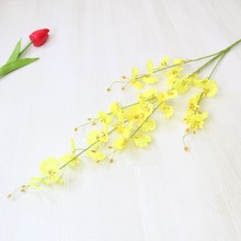 Nhà máy hoa nhân tạo trực tiếp màu vàng đầu năm ngã ba hoa lan phòng khách trang trí phòng ngủ vải lụa hoa giả hoa Wen Xinlan Sản phẩm hoa