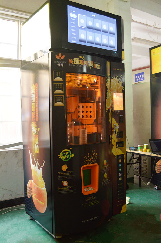 全自动投币式鲜橙榨汁机 商用全自动榨澄汁机 五个橙汁榨汁机